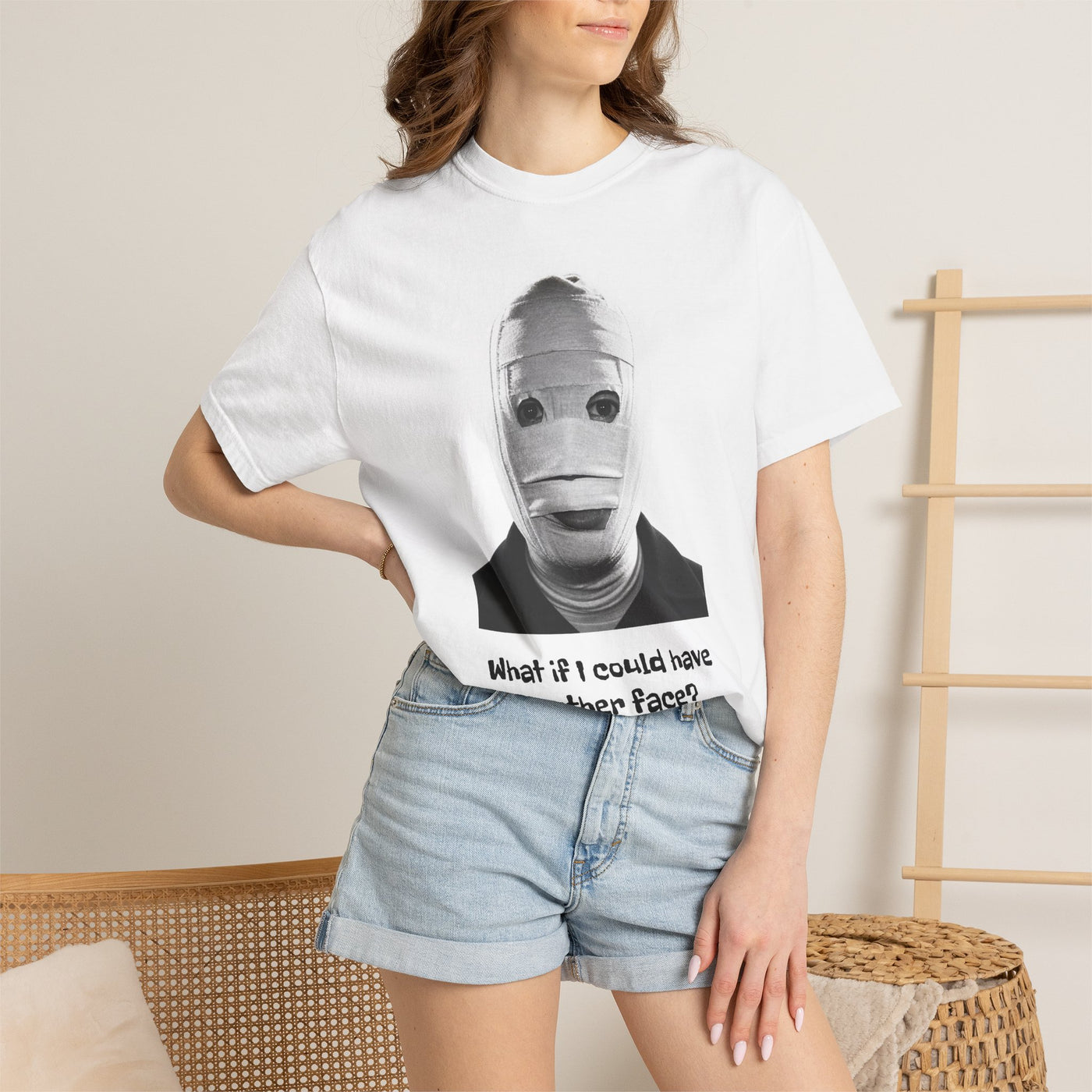The Face of Another literary T-shirt with a bandaged mask and existential question on a garment-dyed unisex T-shirt, product view