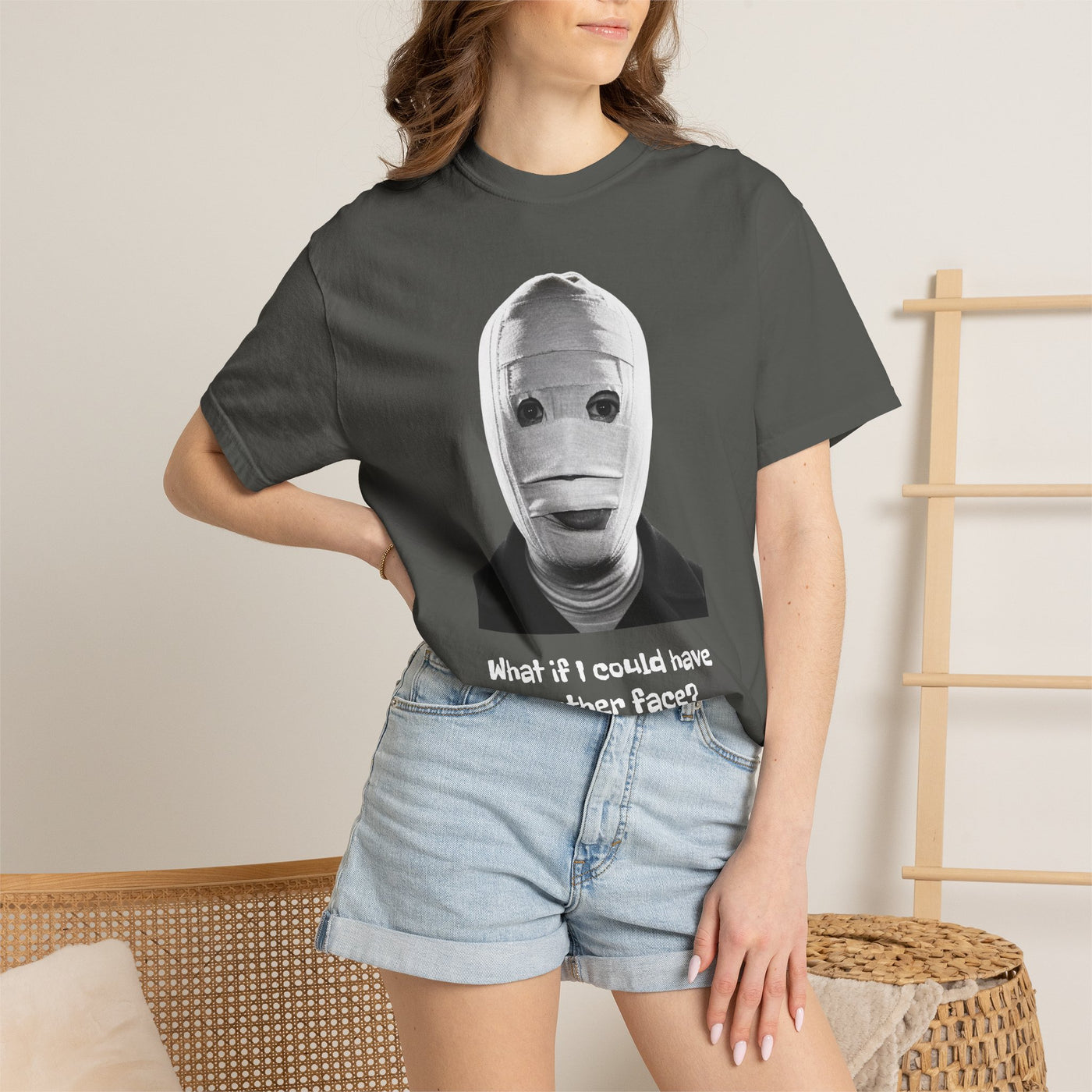 The Face of Another literary T-shirt with a bandaged mask and existential question on a garment-dyed unisex T-shirt, product view