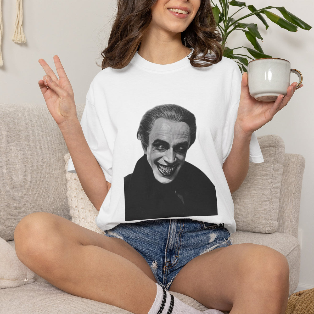 The Man Who Laughs literary T-shirt with Gwynplaine portrait and “The Smile Hid the Man” on a garment-dyed unisex T-shirt, product view