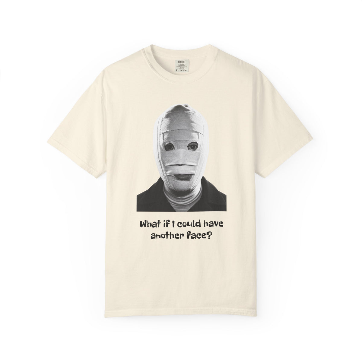 The Face of Another literary T-shirt with a bandaged mask and existential question on a garment-dyed unisex T-shirt, product view