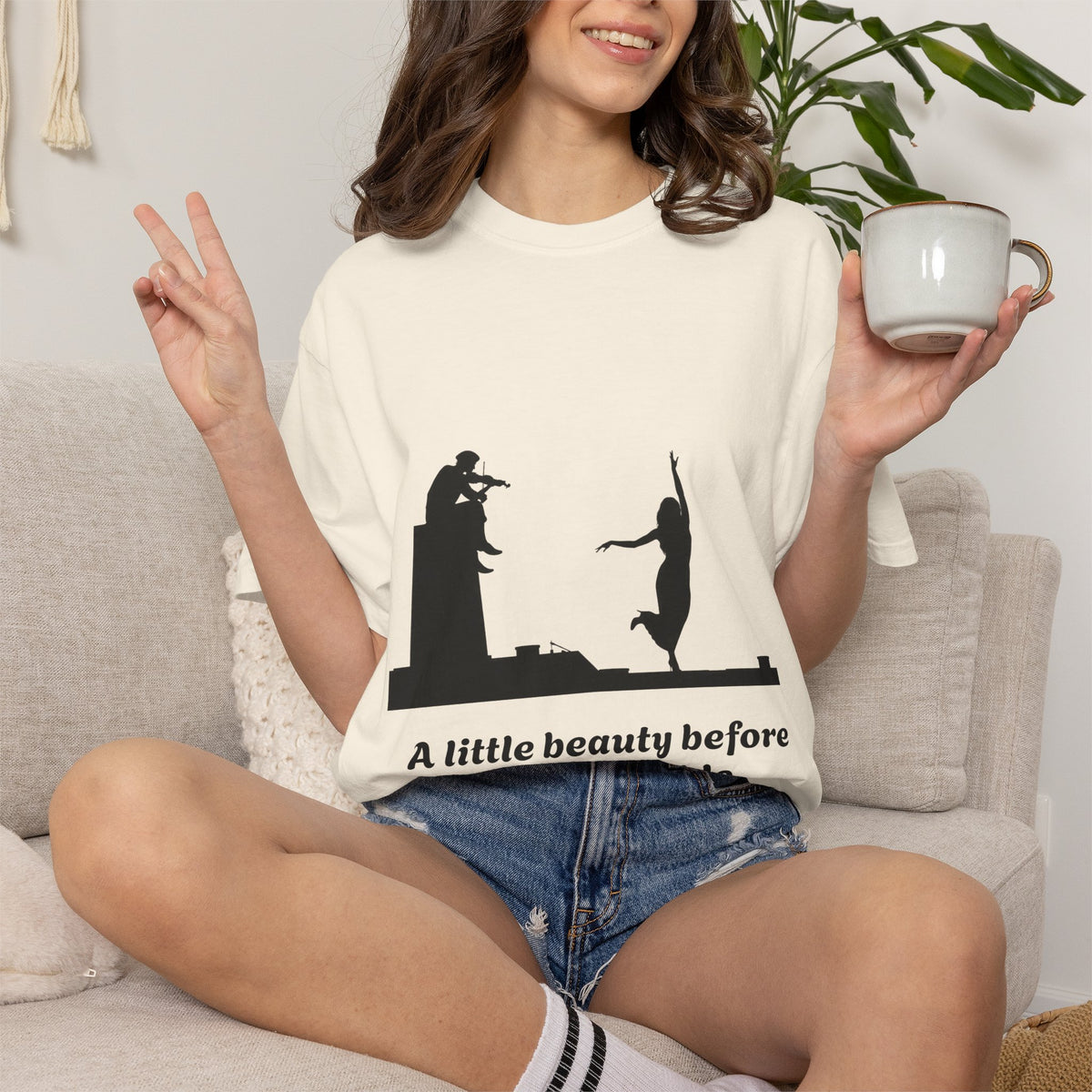 Vintage violin graphic T-shirt showing a violinist, dancing figure and “A Little Beauty Before the Inevitable” on a garment-dyed unisex T-shirt, product view