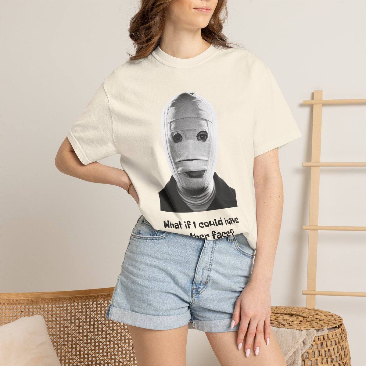 The Face of Another literary T-shirt with a bandaged mask and existential question on a garment-dyed unisex T-shirt, product view