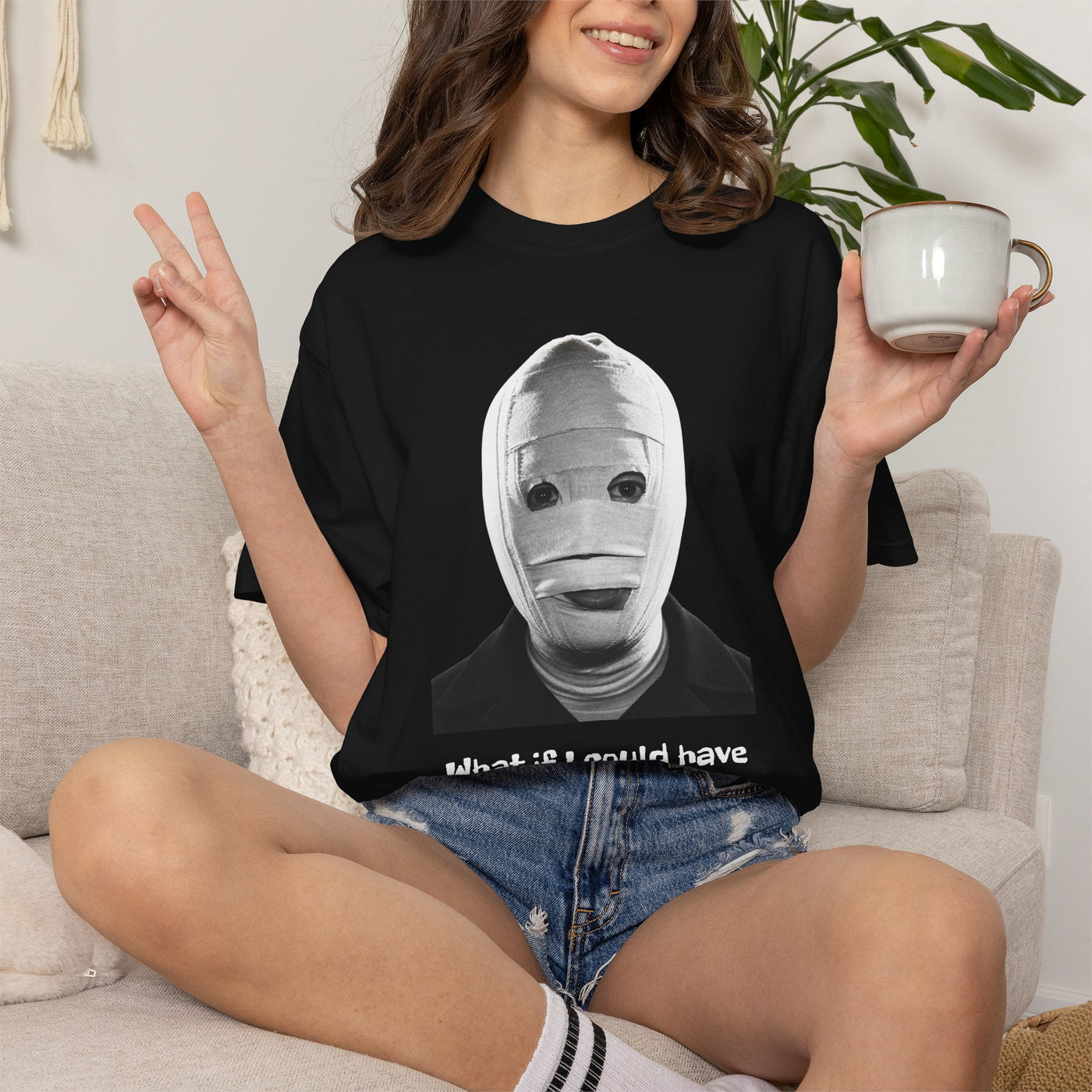 The Face of Another literary T-shirt with a bandaged mask and existential question on a garment-dyed unisex T-shirt, product view