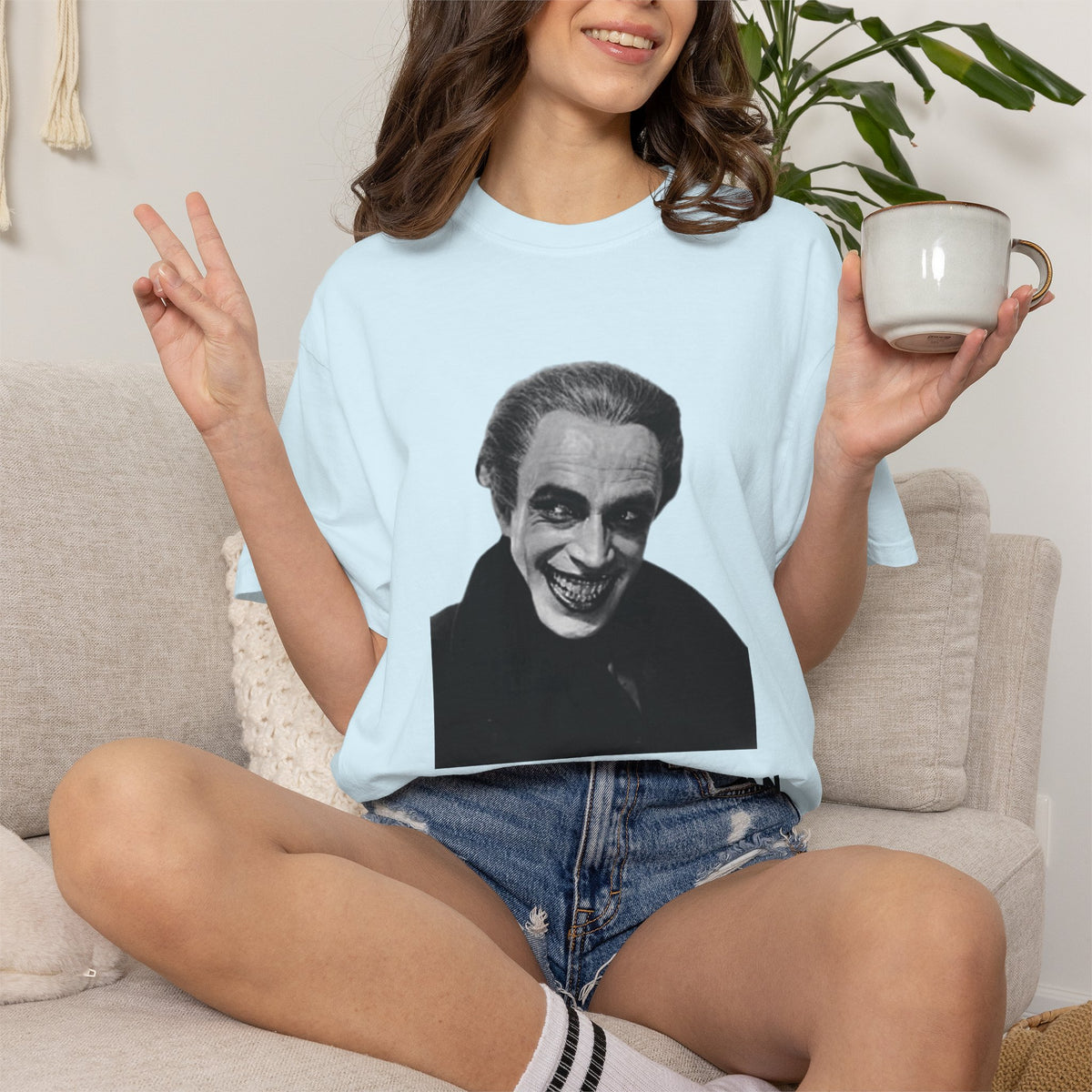 The Man Who Laughs literary T-shirt with Gwynplaine portrait and “The Smile Hid the Man” on a garment-dyed unisex T-shirt, product view