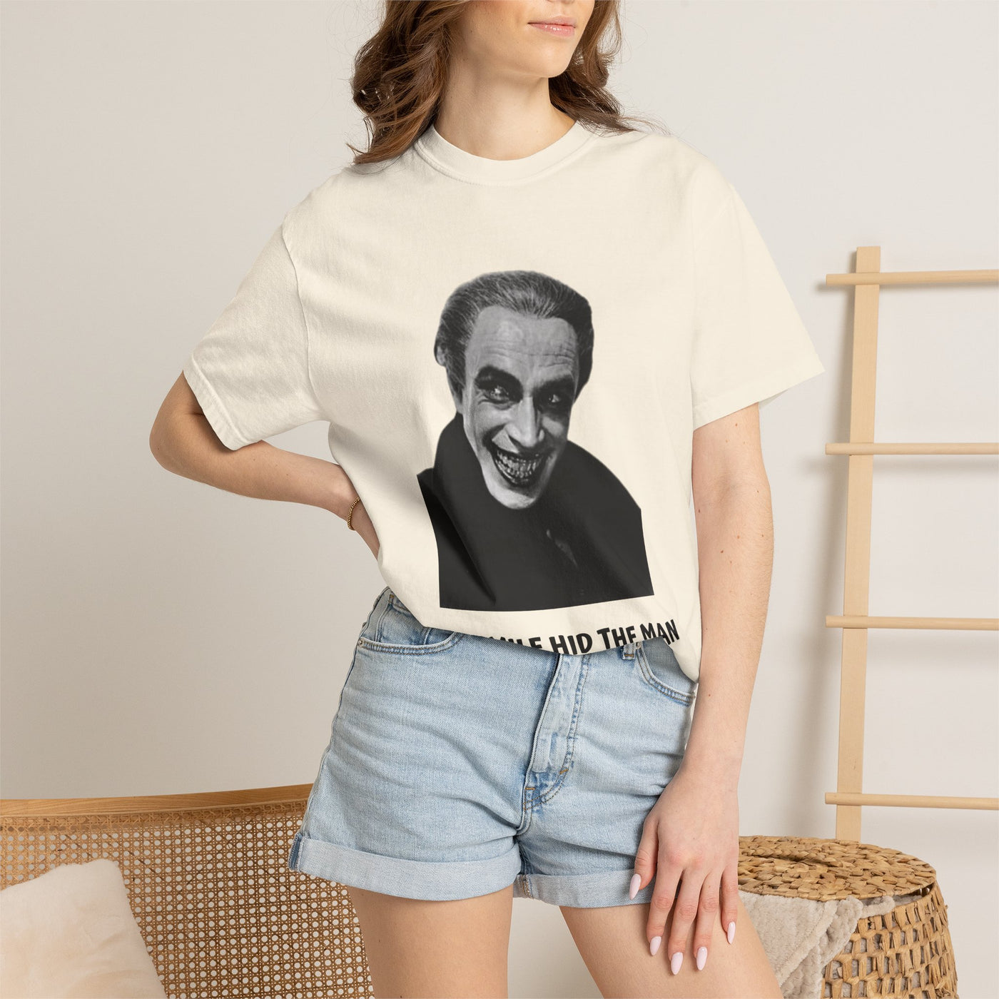 The Man Who Laughs literary T-shirt with Gwynplaine portrait and “The Smile Hid the Man” on a garment-dyed unisex T-shirt, product view