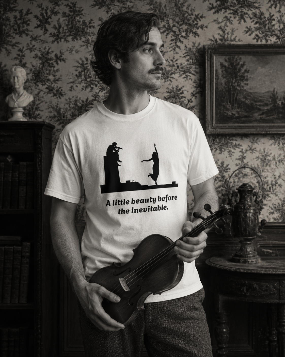 Vintage violin graphic T-shirt showing a violinist, dancing figure and “A Little Beauty Before the Inevitable”